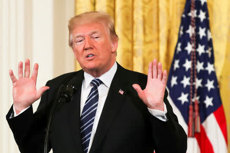 FILE PHOTO: U.S. President Donald Trump gestures as he delivers remarks during the Prison Reform Summit at the White House in Washington, DC, U.S., May 18, 2018. REUTERS/Kevin Lamarque/File Photo