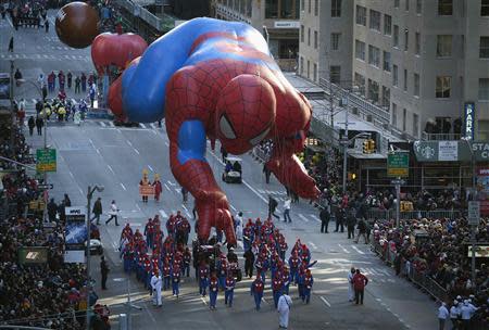 The Spiderman balloon float makes its way down 6th Avenue during the 87th Macy's Thanksgiving day parade in New York November 28, 2013. REUTERS/Carlo Allegri