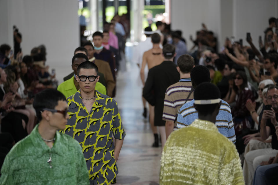 Models wear creations as part of the Gucci men's Spring Summer 2025 collection, that was presented in Milan, Italy, Monday, June 17, 2024. (AP Photo/Luca Bruno)