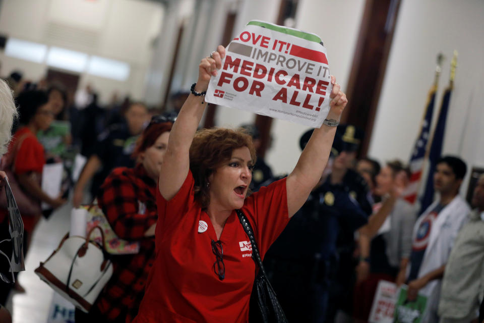 A health care activist affiliated with the National Nurses United labor union protests the Republican health care bill on Wednesday. (Photo: Aaron Bernstein / Reuters)