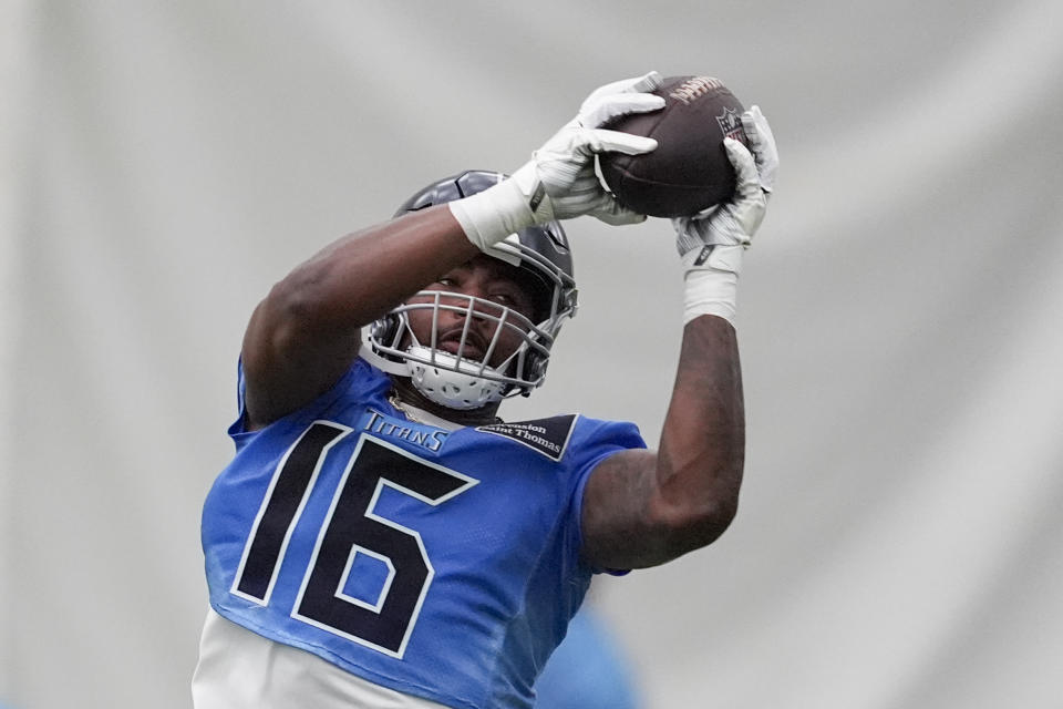 Tennessee Titans wide receiver Treylon Burks (16) makes a catch during NFL football practice Tuesday, June 4, 2024, in Nashville, Tenn. (AP Photo/George Walker IV)