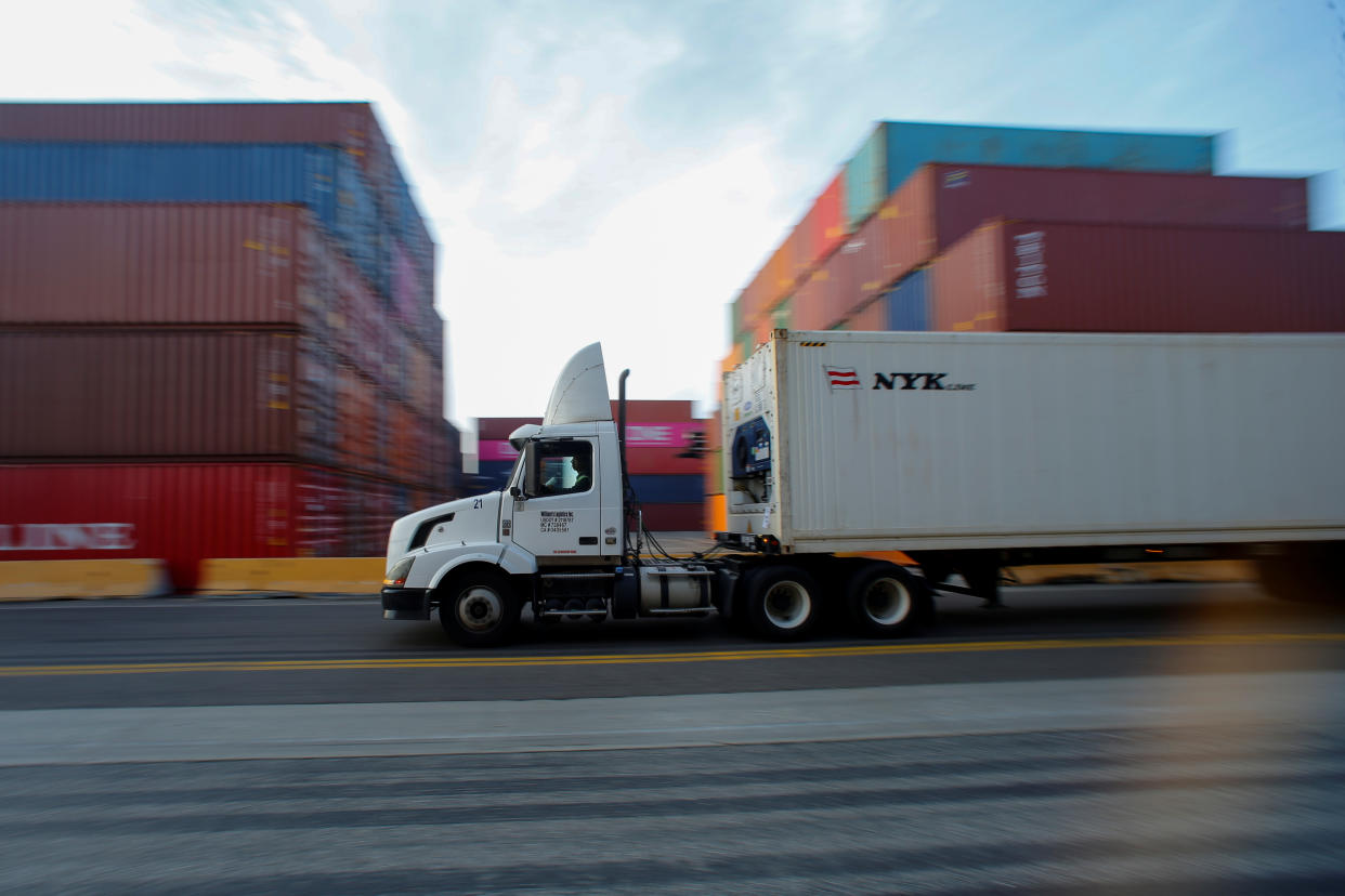 A truck hauls shipping containers at Yusen Terminals (YTI) on Terminal Island at the Port of Los Angeles in Los Angeles, California, U.S., January 30, 2019.   REUTERS/Mike Blake