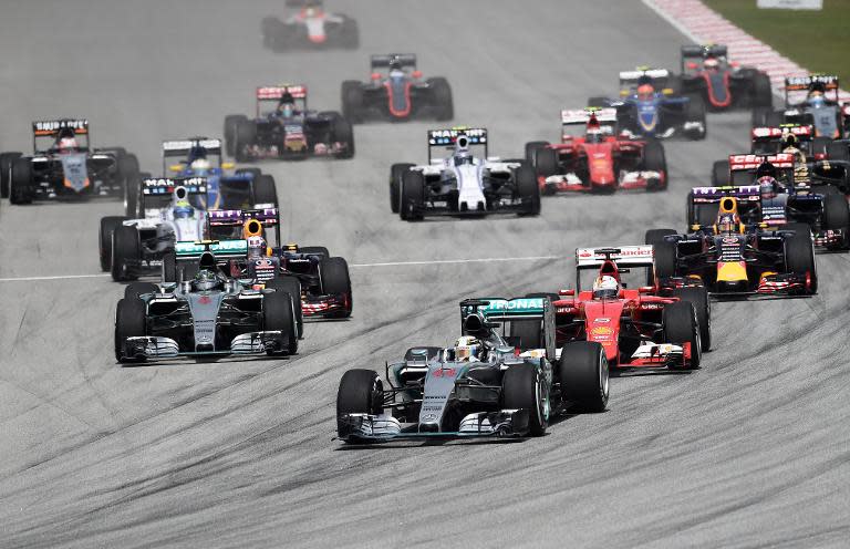 Lewis Hamilton leads the pack in the early laps of the Formula One Malaysian Grand Prix in Sepang on March 29, 2015