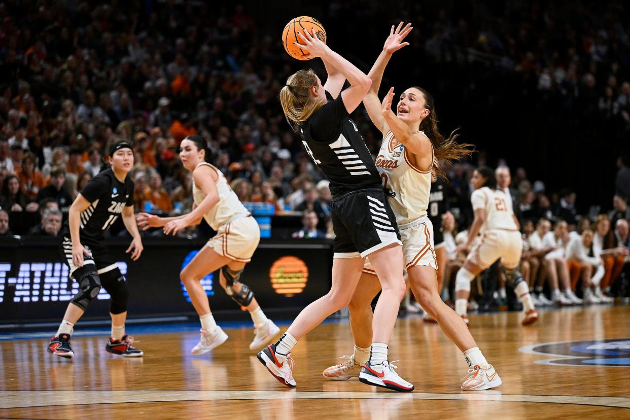 Texas guard Shay Holle puts half-court pressure on Gonzaga guard Brynna Maxwell during the first half of Friday night's Sweet 16 matchup in Portland, Ore. The Longhorns won 69-47 to advance to Sunday's Elite Eight against North Carolina State.