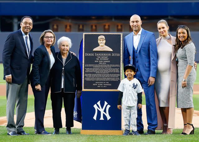 <p>Jim McIsaac/Getty</p> Derek Jeter's father Charles, mother Dorothy, grandmother Dot, nephew Jalen, wife Hannah, and sister Sharlee during his number retirement ceremony