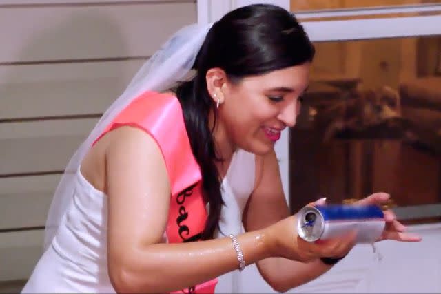 <p>TLC</p> Anali learns how to shotgun a beer.