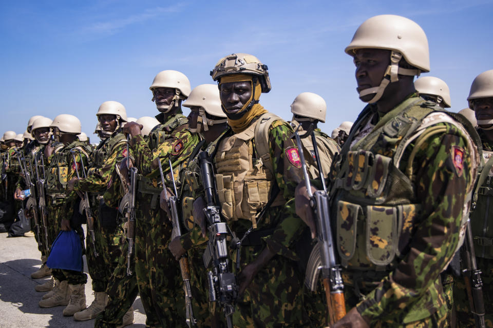 Police from Kenya stand on the tarmac of the Toussaint Louverture International Airport after landing in Port-au-Prince, Haiti, Tuesday, June 25, 2024. The first U.N.-backed contingent of foreign police arrived nearly two years after the Caribbean country requested help to quell a surge in gang violence. (AP Photo/Marckinson Pierre)