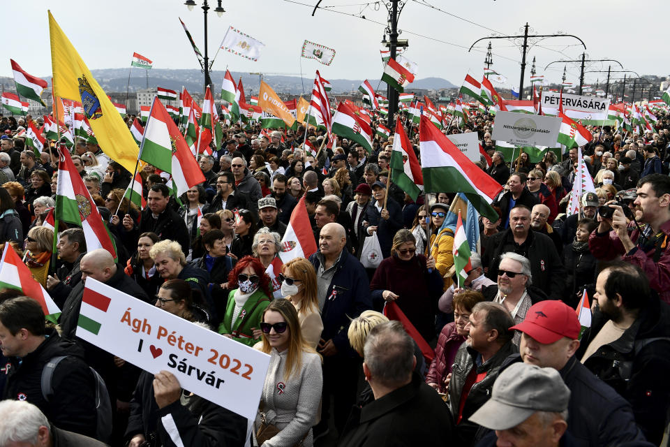 Thousands of supporters of Hungary's right-wing populist prime minister, Viktor Orban, gather in Budapest, Hungary, Tuesday, March 15, 2022. The so-called "peace march" was a show of strength by Orban's supporters ahead of national elections scheduled for April 3, while a coalition of six opposition parties also held a rally in the capital. (AP Photo/Anna Szilagyi)