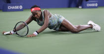 Coco Gauff, of the United States, falls to the court while chasing a shot from Timea Babos, of Hungary, during the second round of the U.S. Open tennis tournament in New York, Thursday, Aug. 29, 2019. (AP Photo/Charles Krupa)