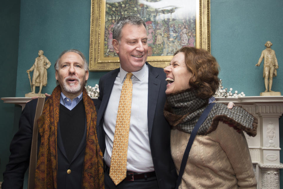 FILE - In this Jan. 5, 2014 file photo, New York City Mayor Bill de Blasio smiles while posing for pictures with visitors at Gracie Mansion in New York, during an open house and photo opportunity with the public. The newly elected de Blasio stooped his 6-foot-5 frame for hours to shake hands with regular New Yorkers touring Gracie Mansion, telling them the opulent mayoral residence was “the people’s house.” De Blasio’s first few weeks in office have offered a look at a mayor skilled in the art of political stagecraft: with the goal, in his case, of coming across as a regular Joe. (AP Photo/John Minchillo, File)
