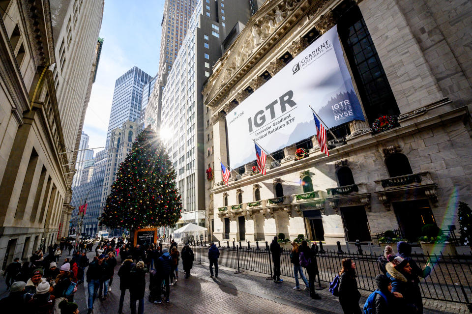 NEW YORK, NEW YORK - DECEMBER 29: A view of the Wall Street Christmas Tree next to the New York Stock Exchange on the right in Downtown Manhattan on December 29, 2022 in New York City. (Photo by Roy Rochlin/Getty Images)