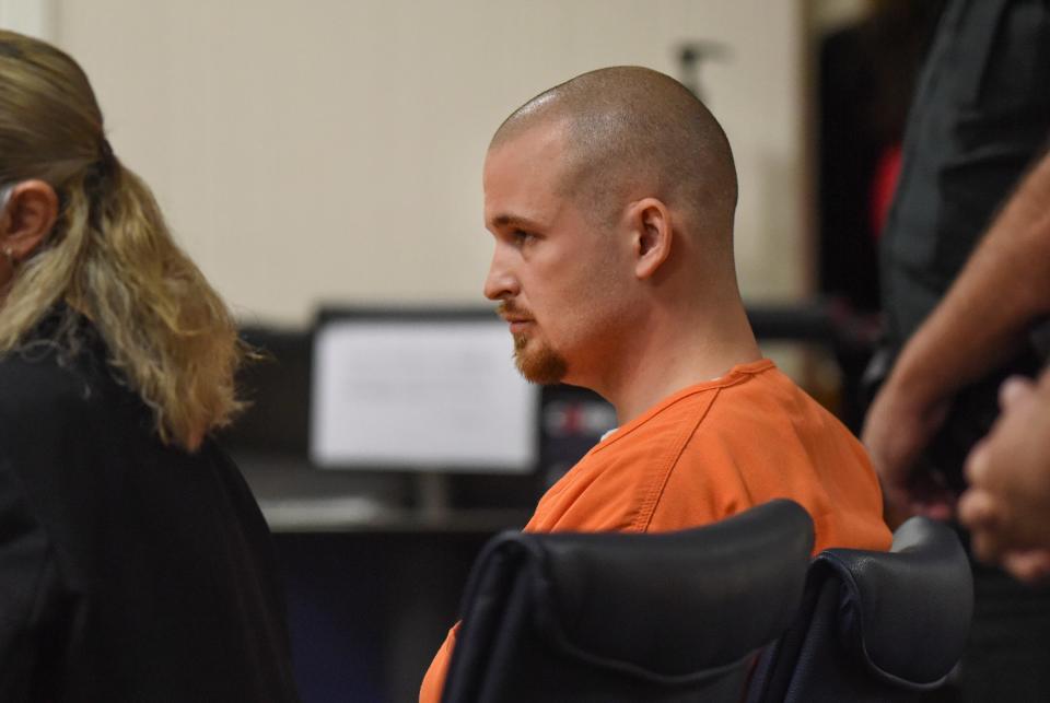 Sitting in the courtroom with his attorney Adrienne Bucchi (left), former Martin County Sheriff's Deputy Steven O'Leary sits frozen as Circuit Judge Sherwood Bauer reads out his sentence of 13 years, less 2.5 years presently served, for dozens of felony charges, during his sentencing at the Martin County Courthouse on Thursday Dec. 2, 2021, in Stuart.