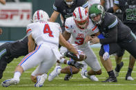 Tulane recovers a fumble after SMU wide receiver T.Q. Jackson (3) dropped a reception during an NCAA college football game in New Orleans, Friday, Oct. 16, 2020. (AP Photo/Matthew Hinton)