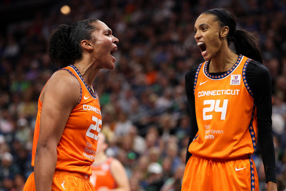 Sep 29, 2024; Minneapolis, Minnesota, USA; Connecticut Sun forward Alyssa Thomas (25) celebrates her shot with forward DeWanna Bonner (24) during the first half against the Minnesota Lynx of game one of the 2024 WNBA Semi-finals at Target Center. Mandatory Credit: Matt Krohn-Imagn Images