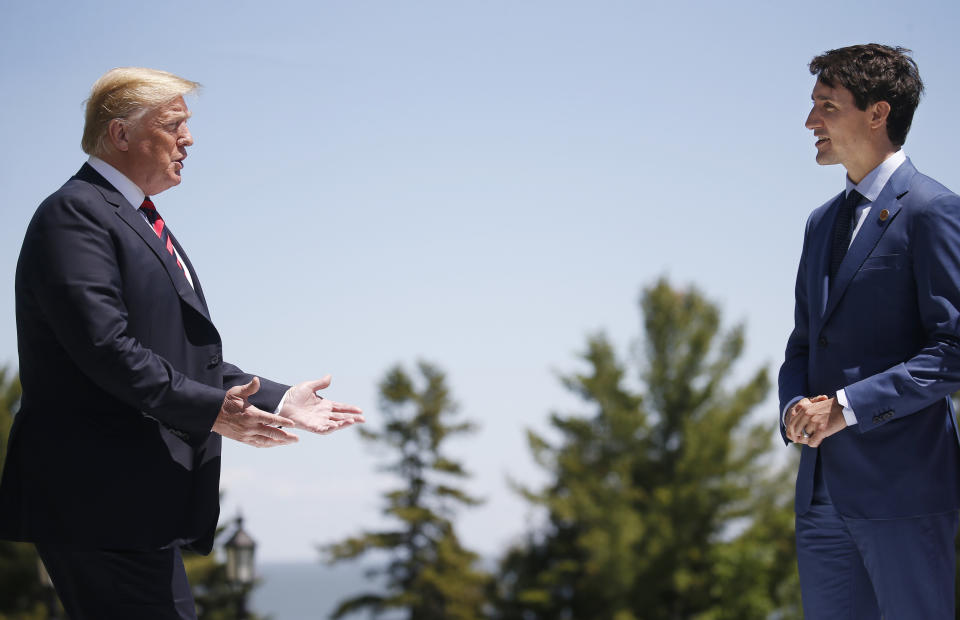 U.S. President Donald Trump approaches Canada's Prime Minister Justin Trudeau as he arrives at the G7 Summit in Charlevoix, Quebec, Canada, June 8, 2018. REUTERS/Leah Millis