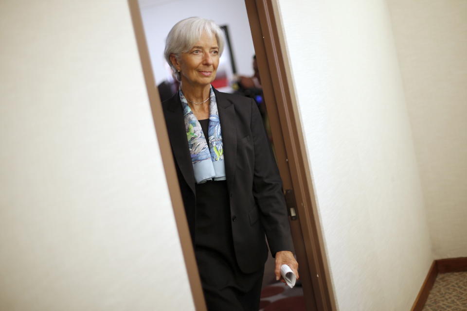 International Monetary Fund (IMF) Managing Director Christine Lagarde returns to her office after an interview at IMF headquarters in Washington July 1, 2015. Greece's last-minute overtures to international creditors for financial aid on Tuesday were not enough to save the country from becoming the first developed economy to default on a loan with the International Monetary Fund. REUTERS/Jonathan Ernst