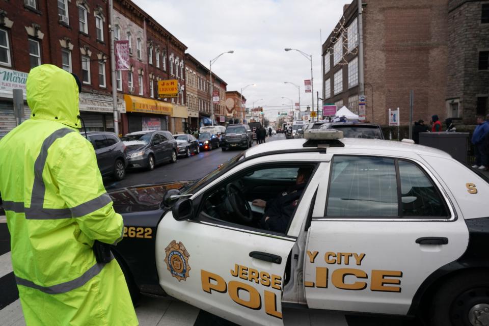 Jersey City police gather at the scene of Tuesday's shooting in Jersey City, New Jersey. (Photo: BRYAN R. SMITH via Getty Images)