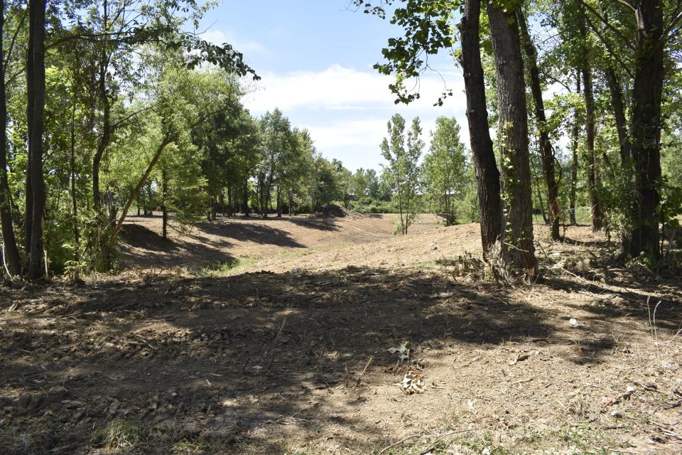 The site of a former homeless encampment behind the At Home store in Bloomington has been cleared out.