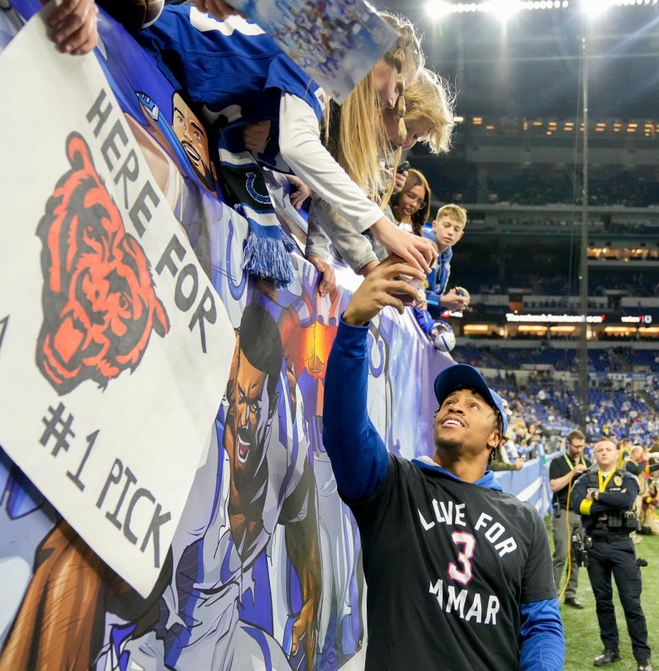 Indianapolis Colts running back Jonathan Taylor (28) takes selfies with fans Sunday, Jan. 8, 2023, before a game against the Houston Texans at Lucas Oil Stadium in Indianapolis.