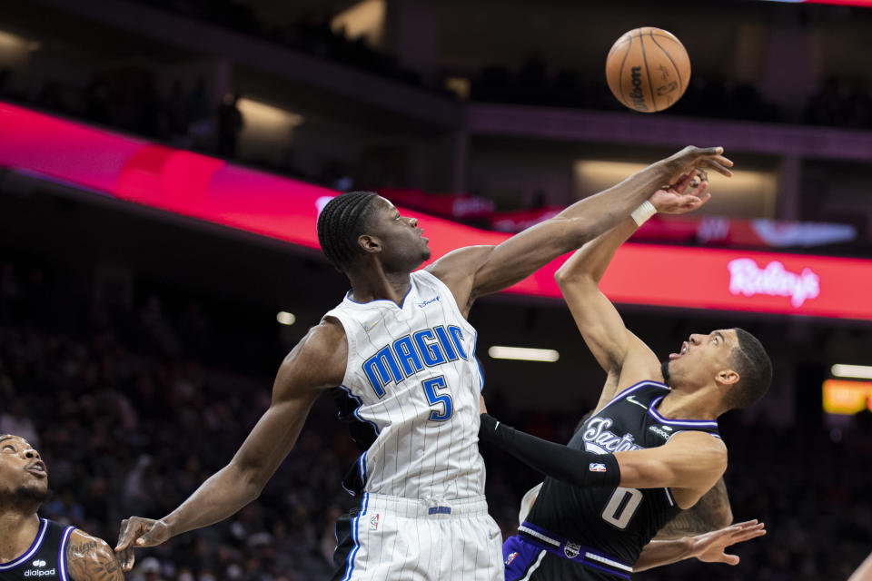 Orlando Magic center Mo Bamba (5) blocks the shot of Sacramento Kings guard Tyrese Haliburton (0) during the first quarter of an NBA basketball game in Sacramento, Calif., Wednesday, Dec. 8, 2021. (AP Photo/Jose Luis villegas)