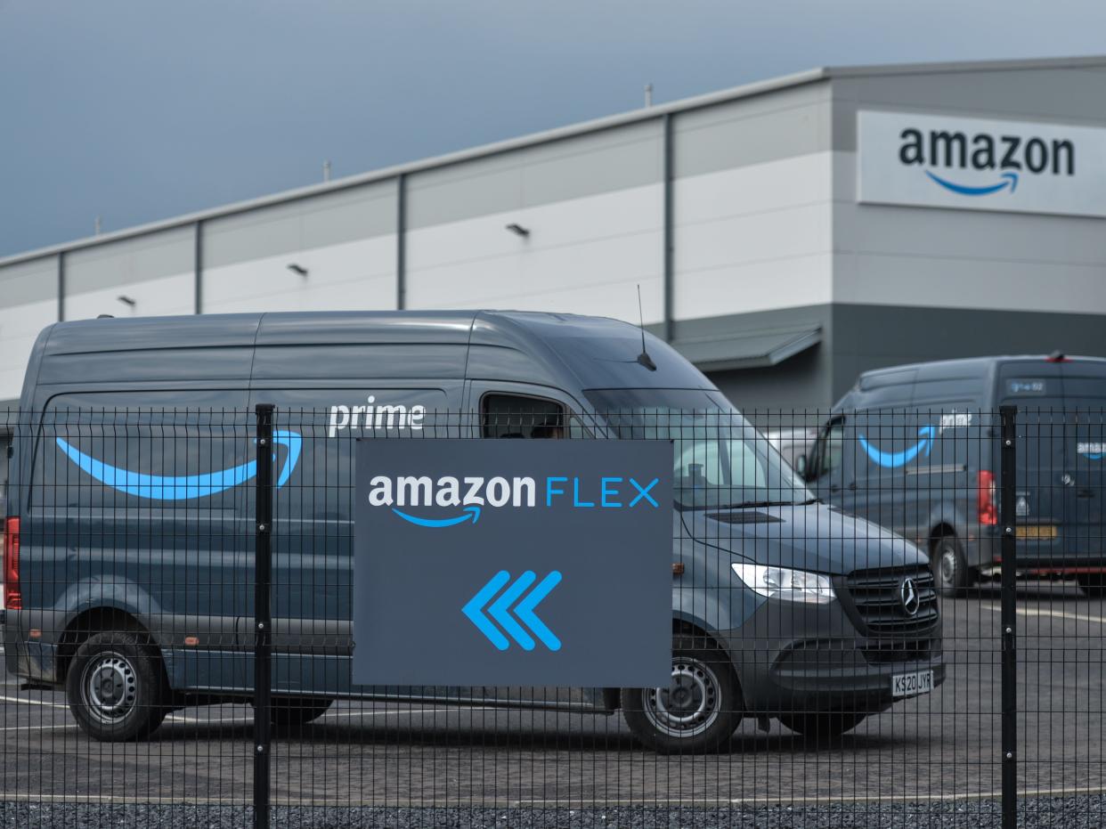 An Amazon Flex sign is shown with vehicles behind.