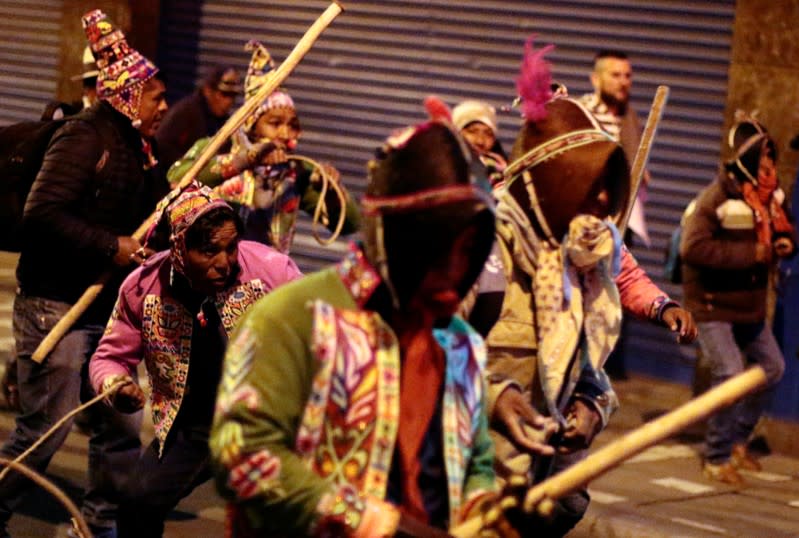 Supporters of Bolivia's President Evo Morales clash with Morales' opponents, in La Paz