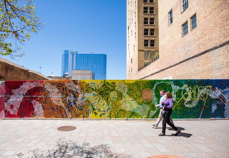 People walk past a mural on Main Street at the site where the Utah Pantages Theater once stood on Thursday. | Carter Williams, KSL.com