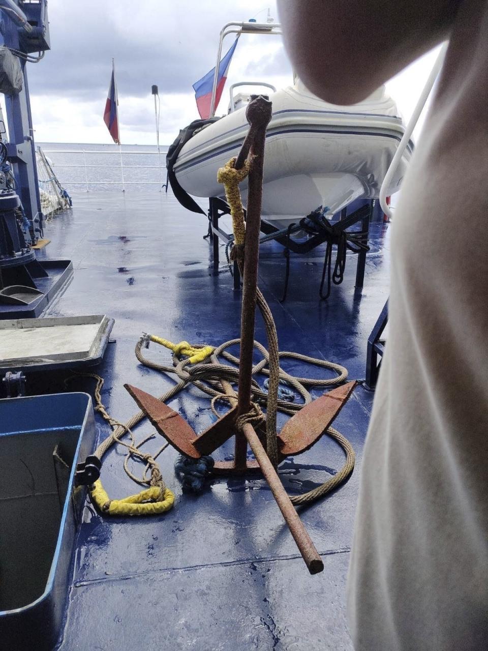 This undated photo provided on Sept. 26, 2023, by Philippine Coast Guard shows the anchor used to hold the floating barrier which were removed by the coast guard diver, in the Scarborough Shoal. The Philippine coast guard said Monday, Sept. 25, it has complied with a presidential order to remove a floating barrier placed by China’s coast guard to prevent Filipino fishing boats from entering a lagoon in a disputed shoal in the South China Sea. (Philippine Coast Guard via AP)