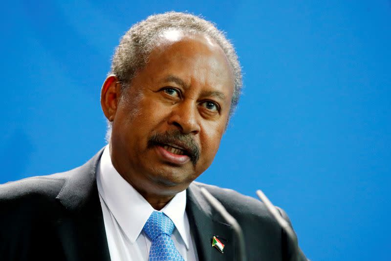 FILE PHOTO: FILE PHOTO: Sudan's Prime Minister Abdalla Hamdok and German Chancellor Angela Merkel (not pictured) address the media at the Chancellery in Berlin