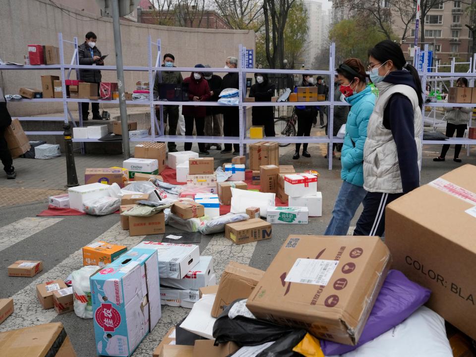 Residents pick up their delivery orders.