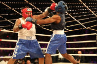 <p>John Chalen (red) battles Reshawn Merrick (blue) in the Bronx Precinct Callout during the NYPD Boxing Championships at the Hulu Theater at Madison Square Garden on March 15, 2018. (Gordon Donovan/Yahoo News) </p>