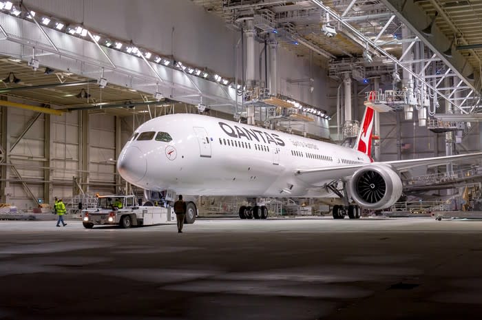 A Qantas jet parked in a hangar