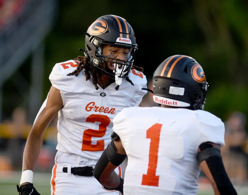 Green wide receiver Jarrett Taylor celebrates a first quarter touchdown by Antonio Martin at Jackson.  Friday, Sept 8, 2023.