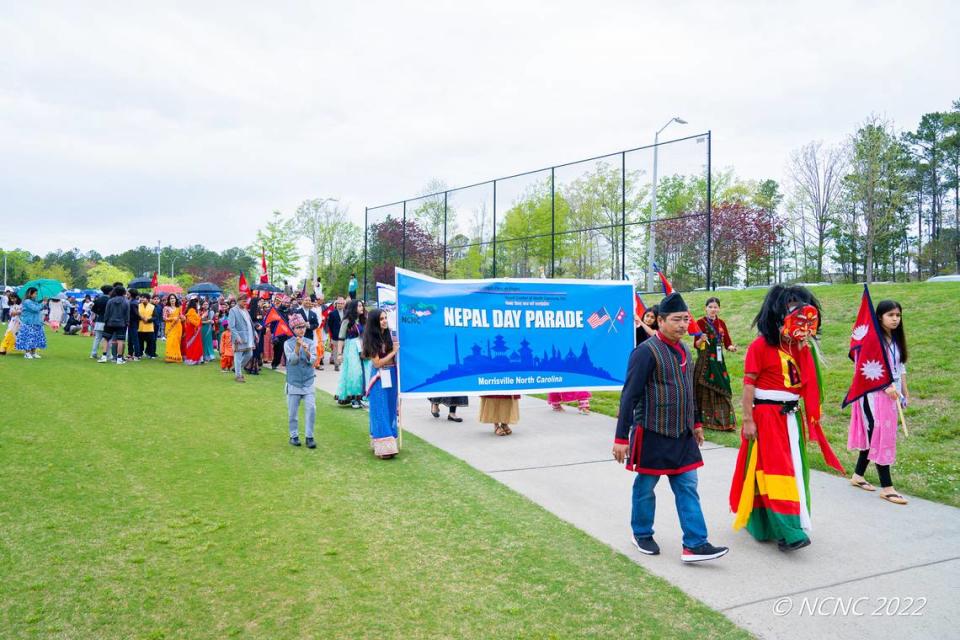 Nepal Day celebrations begin with a parade around Church Street Park in Morrisville where participants and attendees showcase Nepali garments, symbols, and flags.