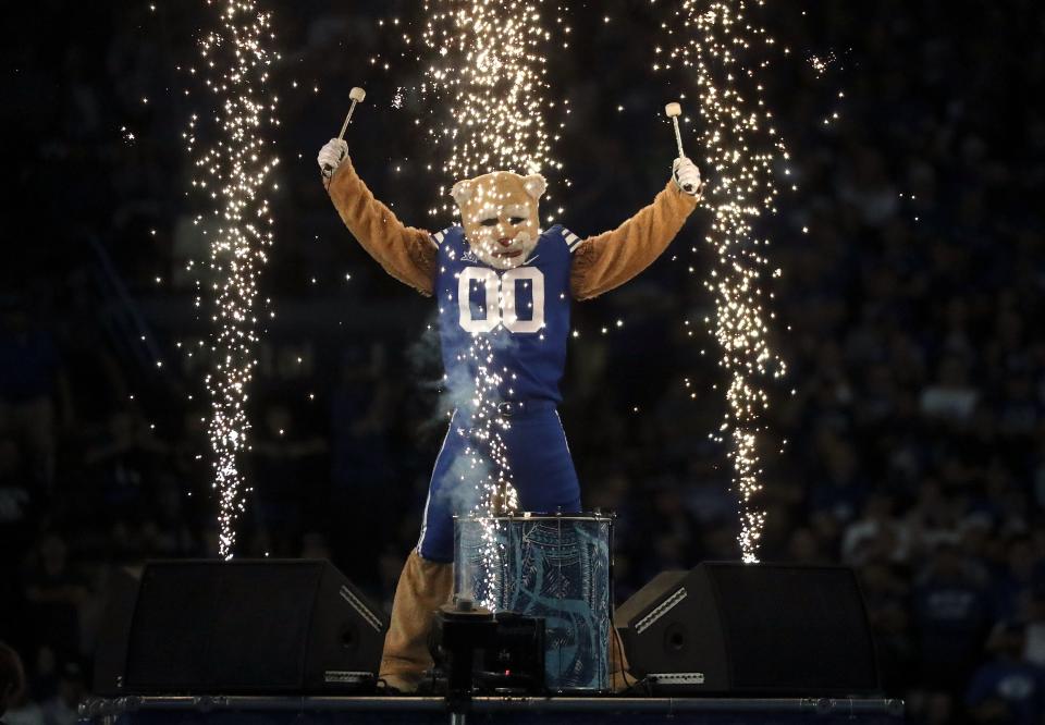 Cosmo plays a drum during a break in a football game between the Brigham Young Cougars and the Cincinnati Bearcats at LaVell Edwards Stadium in Provo on Friday, Sept. 29, 2023. BYU won 35-27. | Kristin Murphy, Deseret News