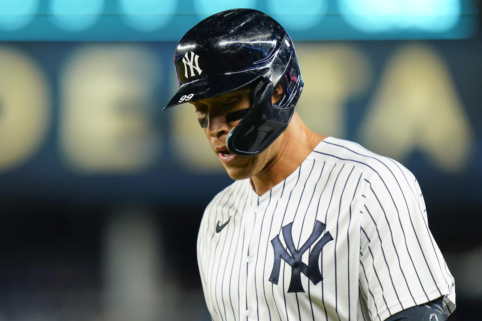 New York Yankees' Aaron Judge walks to the dugout after hitting into a double play during the sixth inning of the team's baseball game against the Baltimore Orioles on Tuesday, May 24, 2022, in New York. (AP Photo/Frank Franklin II)