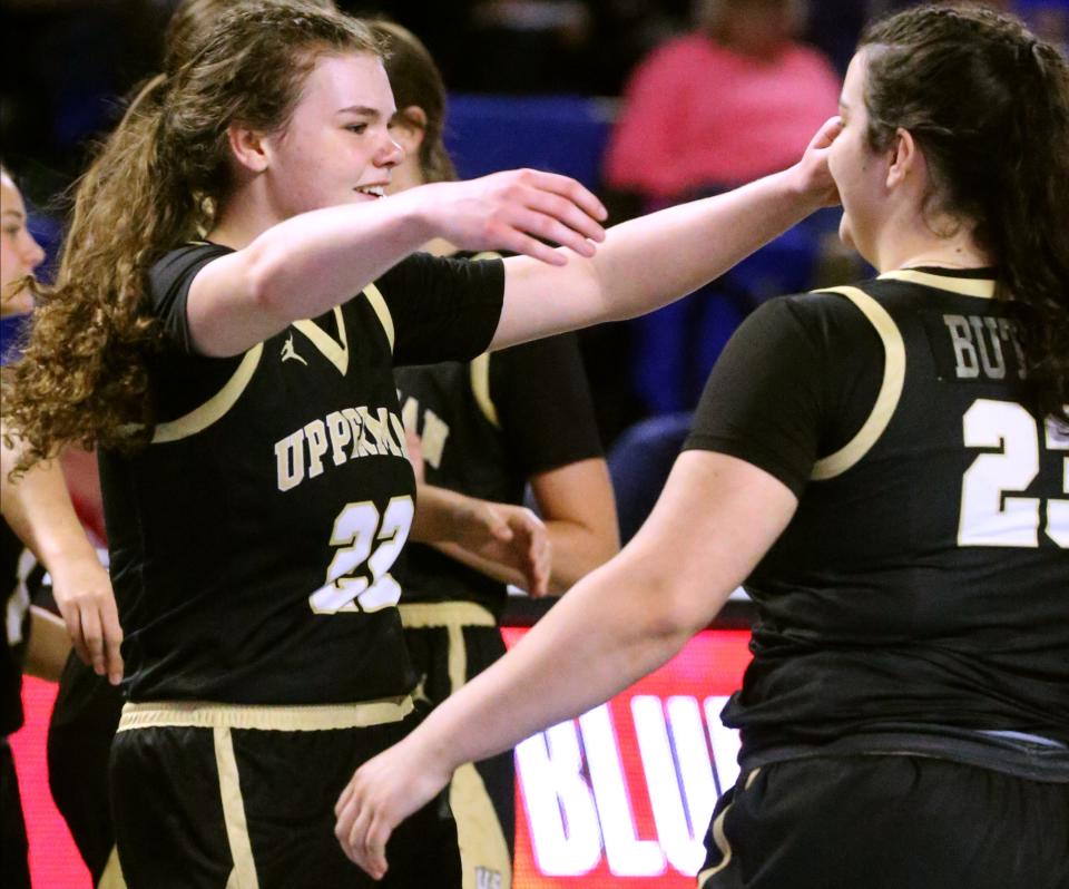 Upperman's guard Gracie Butler (22) celebrates Upperman’s win over Greeneville by hugging her twin sister Upperman's guard Maggie Butler (23) after a TSSAA high school girls basketball Quarterfinal Class 3-A game against, on Thursday, March 7, 2024. Upperman's guard Maggie Butler (23) played in the final moments of the Quarterfinal game for the the first time after suffering a knee injury.