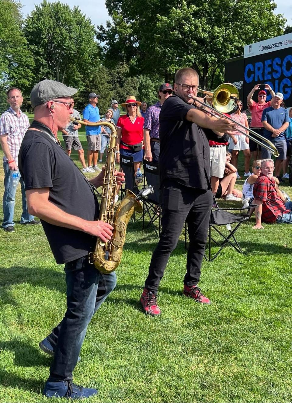 Members of The Vindys' brass section perform during a recent concert at the Firestone Country.