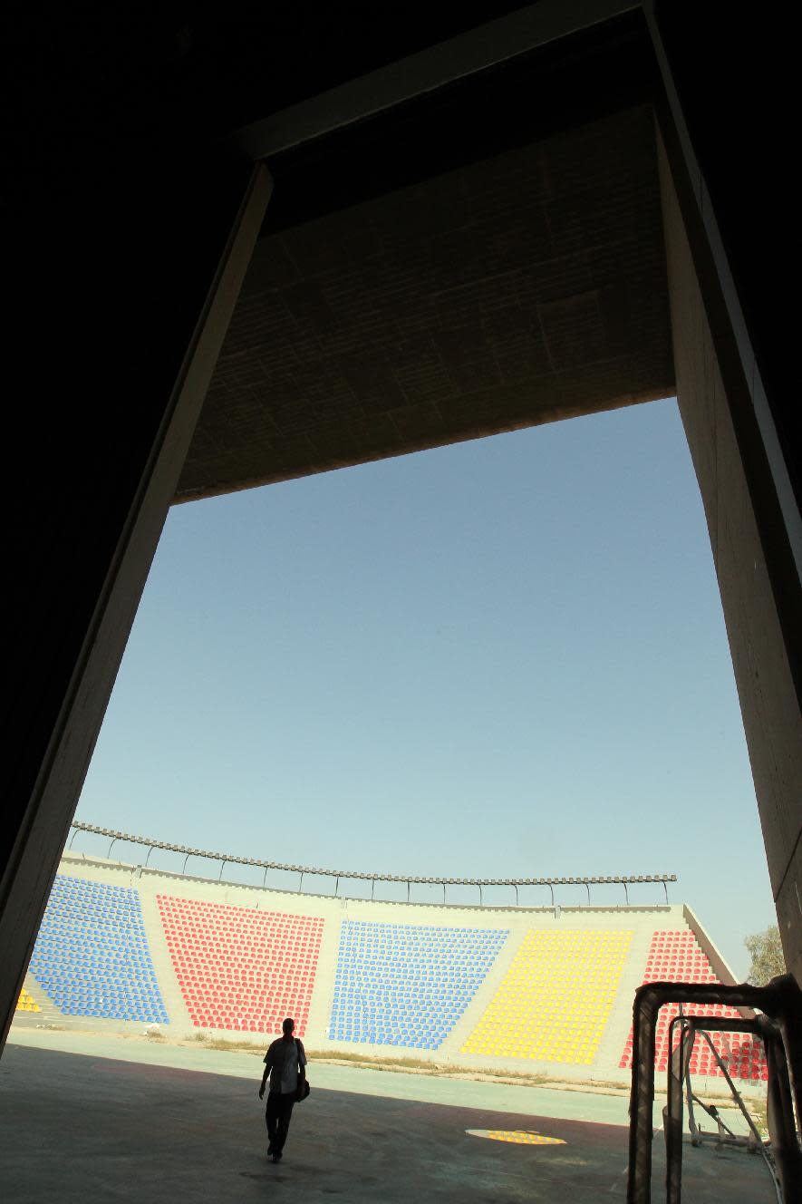 An Iraqi man walks into the Le Corbusier-designed gymnasium of Baghad on April 12, 2012.