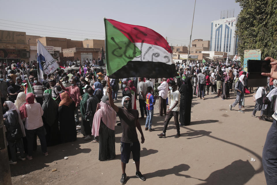 People gather during a protest in Khartoum, Sudan, Thursday, Jan. 13, 2022. Thousands of people took to the streets on Thursday against a coup that has plunged the country into grinding deadlock. (AP Photo/Marwan Ali)