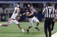 Texas A&M quarterback Max Johnson (14) is forced out of bounds by Arkansas defensive back Myles Slusher (2) during the second half of an NCAA college football game Saturday, Sept. 24, 2022, in Arlington, Texas. Texas A&M won 23-21. (AP Photo/Brandon Wade)