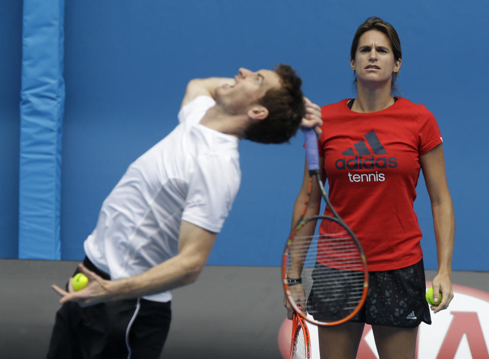 FILE - Britain's Andy Murray serves as he is watched by his coach Amelie Mauresmo during a practice session at Melbourne Park ahead of the Australian Open tennis championship in Melbourne, Australia, Thursday, Jan. 15, 2015. For all of that progress, there remains an aspect of tennis in which gender equity is nowhere near being achieved: coaching. “It’s strange. I’m probably surprised ... there’s not more female coaches across both tours,” Murray said. (AP Photo/Mark Baker, File)