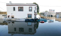 <p>The Tornado’s Grub & Pub sits surrounded in flood waters from the Cedar River, Tuesday, Sept. 27, 2016, in Cedar Rapids, Iowa. (AP Photo/Charlie Neibergall)</p>