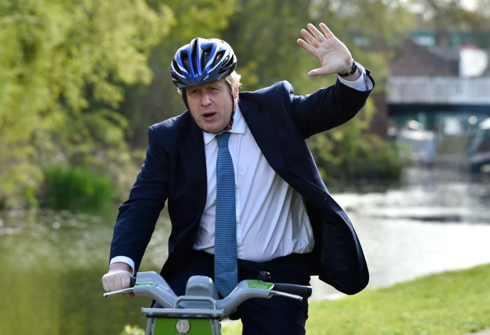 British Prime Minister Boris Johnson rides a bike on the towpath of the Stourbridge canal  during a Conservative party local election visit in Stourbridge, central England on May 5, 2021. - Local elections take place in England on Thursday. (Photo by Rui Vieira / POOL / AFP) (Photo by RUI VIEIRA/POOL/AFP via Getty Images)