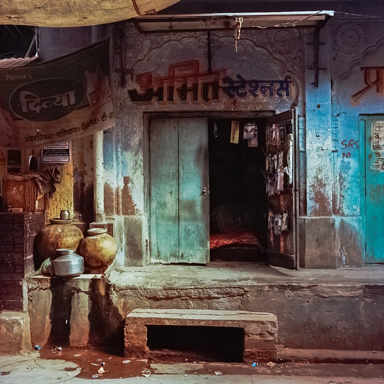 <p>Pots used to store water sit on a wall alongside a makeshift stall in the old quarters of the Indian city of Jodhpur on March 18, 2016. Rajasthan’s ‘Blue City’ Jodhpur is famed for the blue-painted walls of the old city that sits in the shadow of the Mehrangarh Fort. Used to denote Brahmin, or upper-caste, households, discouraging looters if the city ever came under attack, many of Jodhpurs buildings retain the traditional blue paintwork that has come to signify the city. </p>