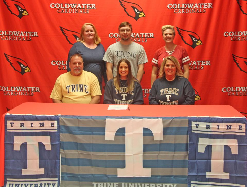 Coldwater's McKenna Hantz, surrounded by family and coaches, recently signed her letter of intent top compete with Trine University's Acrobatics and Tumbling team