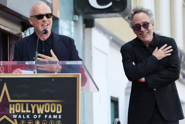 <p>Amy Sussman/Getty</p> Michael Keaton and Tim Burton