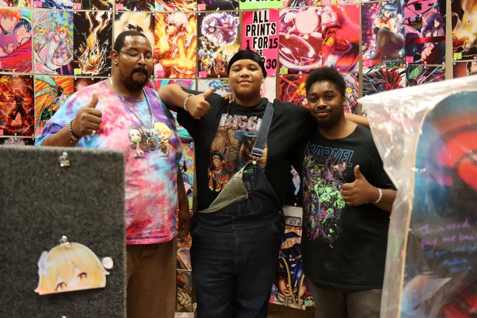 Matthew Harris Sr., Matthew Harris Jr., and D. Harris sell posters and prints at the Amarillo Super Mini-Con at the Amarillo Civic Center in this 2022 file photo.