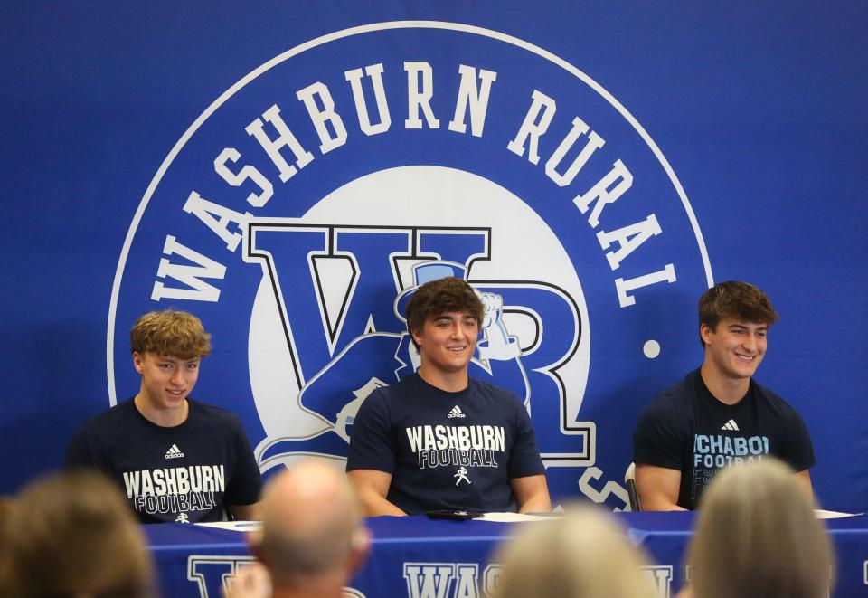 Washburn Rural's Branton DeWeese, Jaren Heim and JC Heim during their signing day on Thursday, Feb. 22.