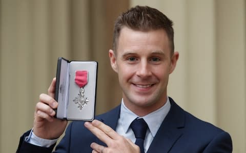 Superbike world champion Jonathan Rea poses after being presented with an MBE by the Duke of Cambridge during an Investiture ceremony at Buckingham Palace on November 21, 2017 in London - Credit: Getty Images Europe